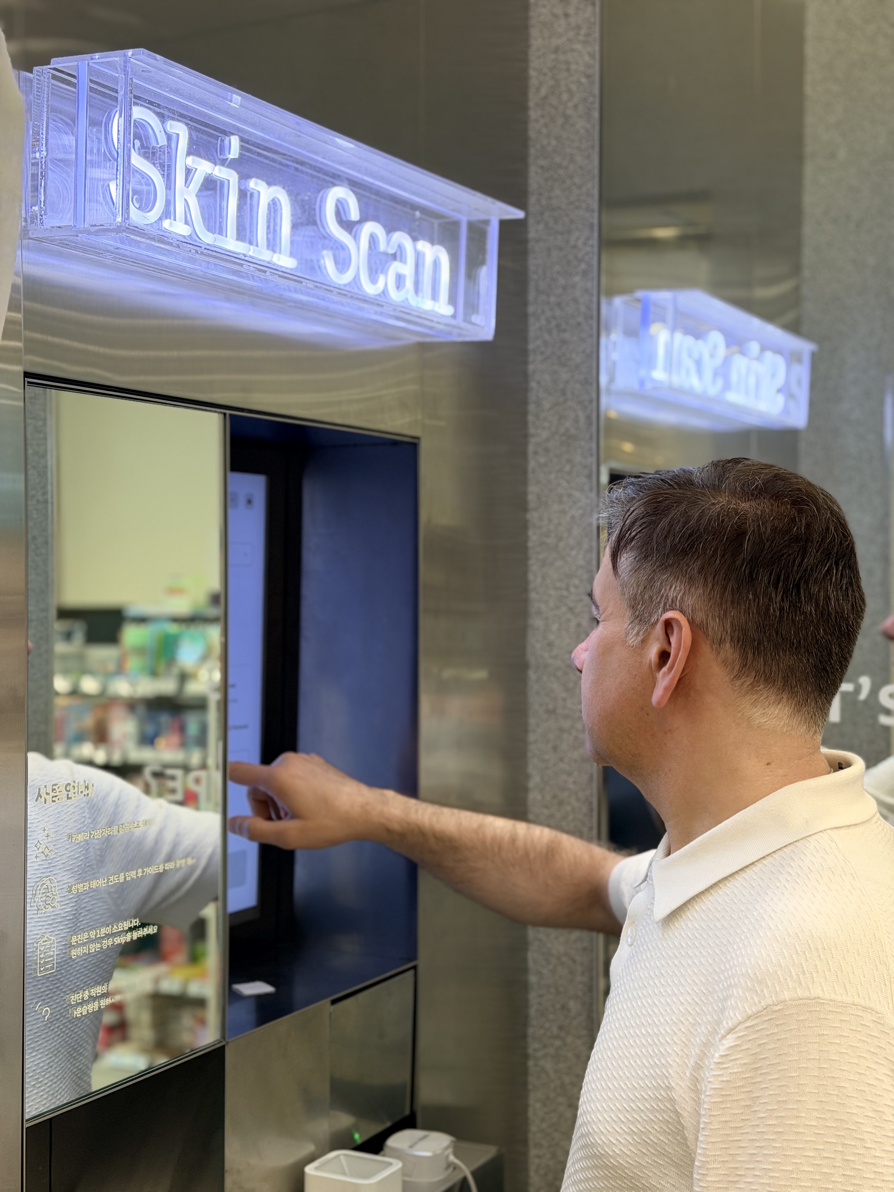 Customer using the Skin Scan touch interface during an in-store consultation