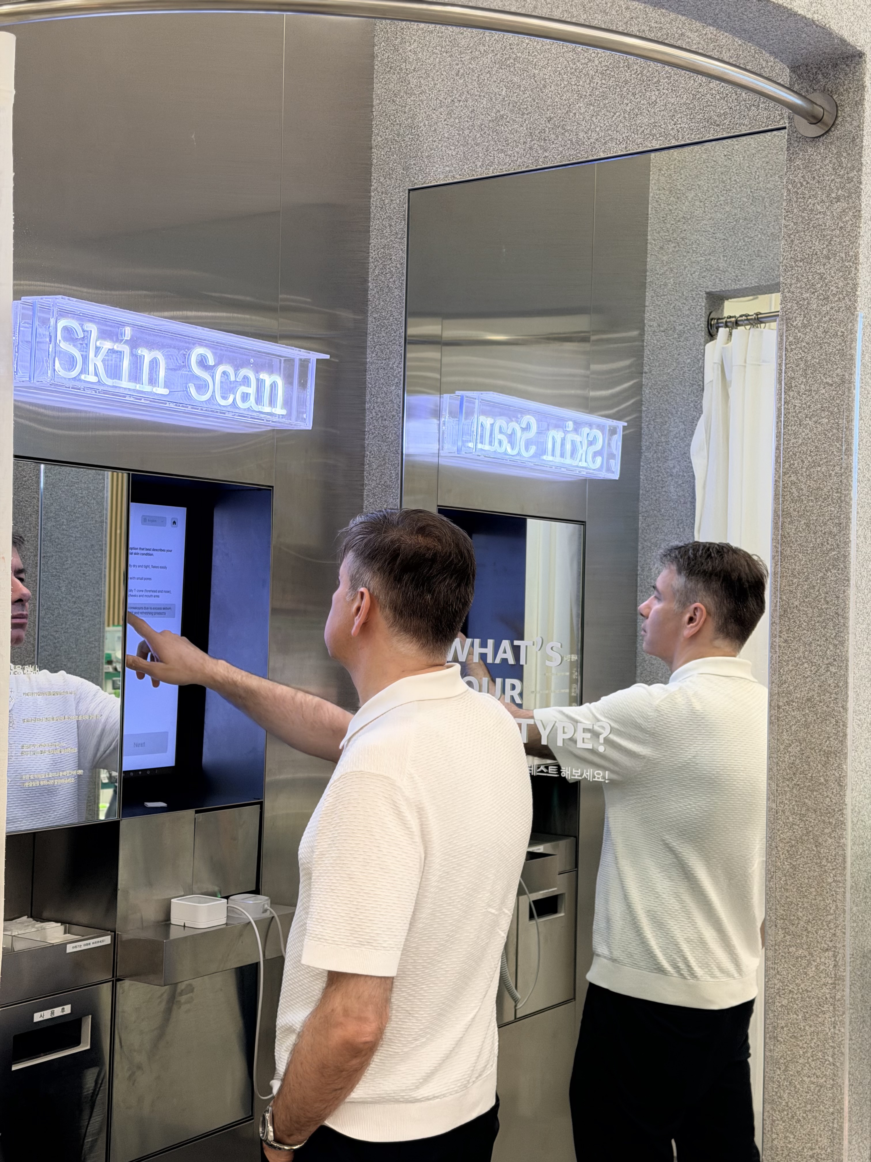 Customer interacting with the Skin Scan consultation interface in store